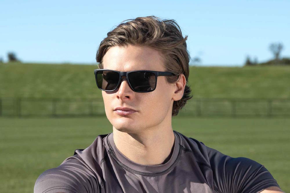 Nolan eyeglasses frame worn by model.