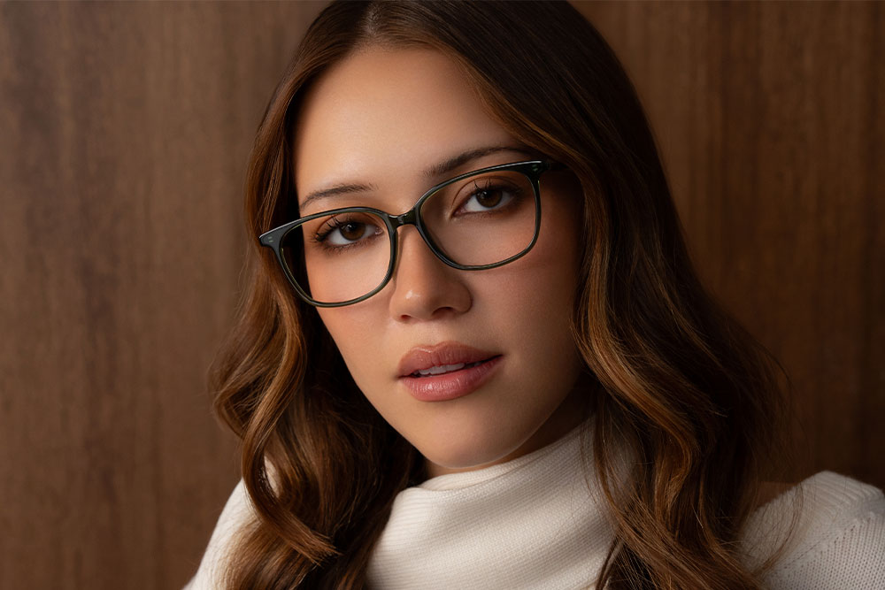 Model wearing Oscar Wylee Emma acetate optical frames.