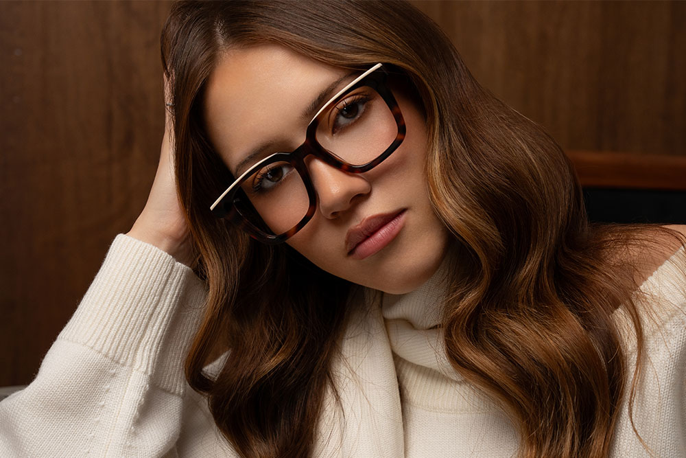 Model wearing Oscar Wylee Yumi acetate optical frames.