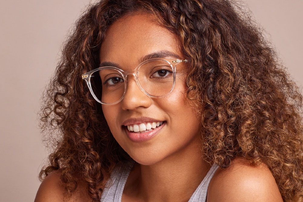 Watts TR/Ultem material eyeglasses frame worn by model.