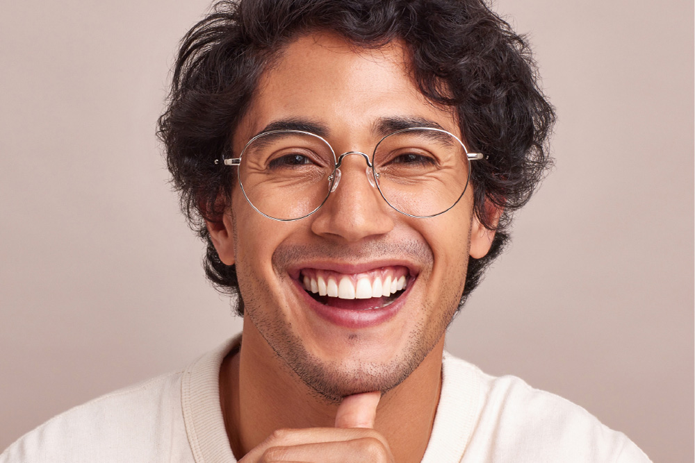 Kato eyeglasses frame worn by model.