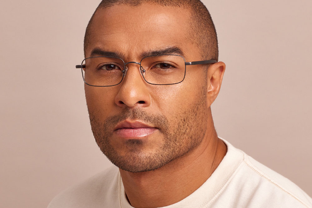 Cole eyeglasses frame worn by model.