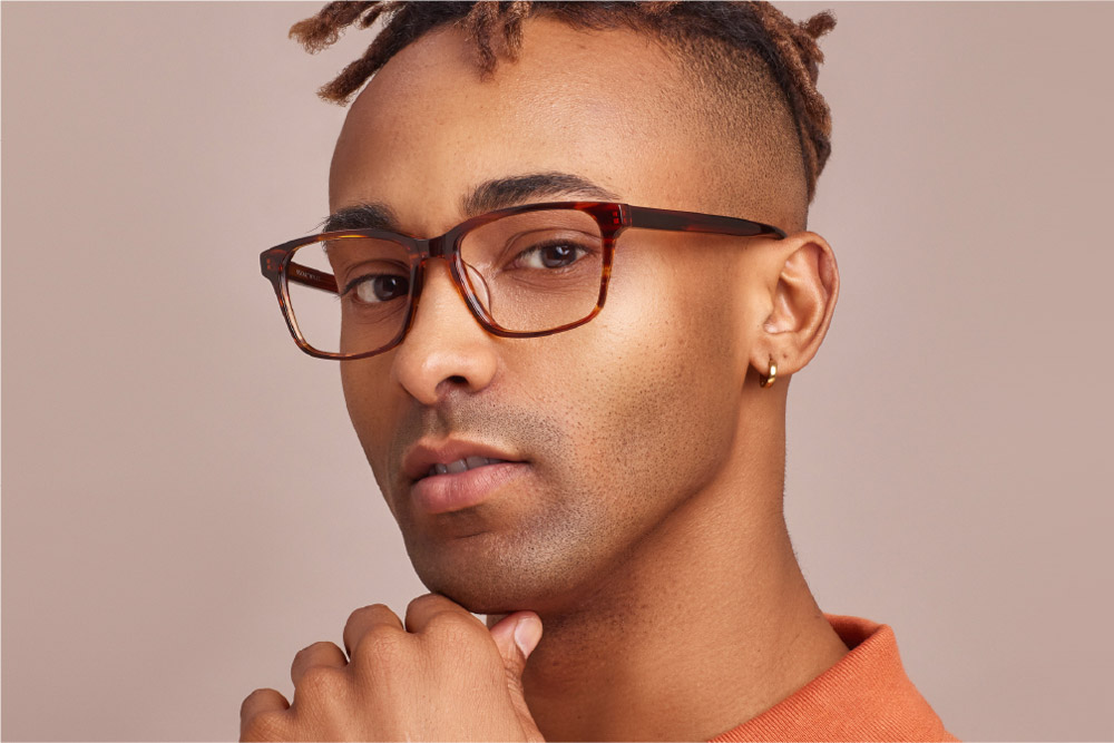 Windsor eyeglasses frame worn by model.