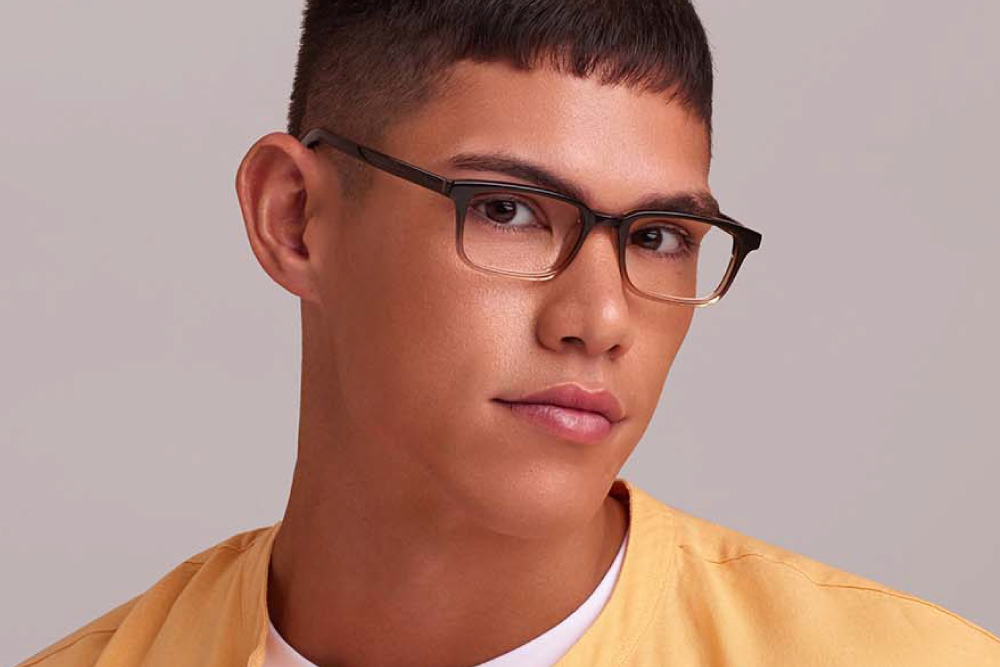 Prue eyeglasses frame worn by model.