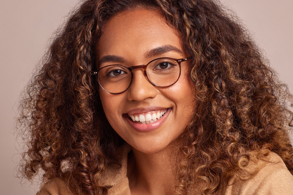 Mischa eyeglasses frame worn by model.