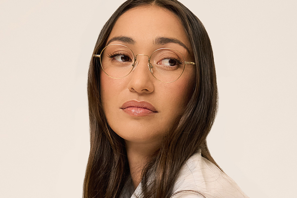Mackenzie eyeglasses frame worn by model.